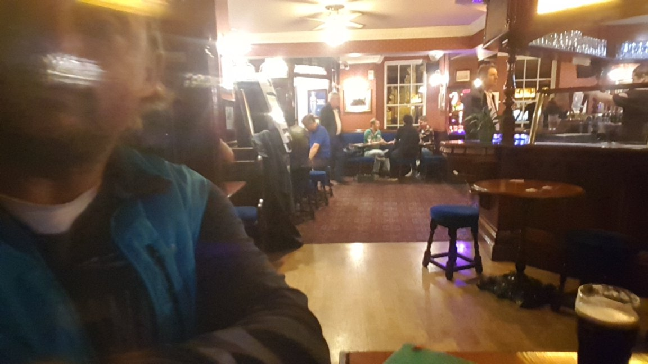 Inside the pub having a guniess.