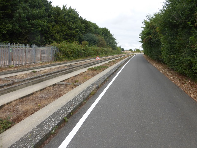Image of a off road bus commuting for non cyclist that runs along side a cycle path..