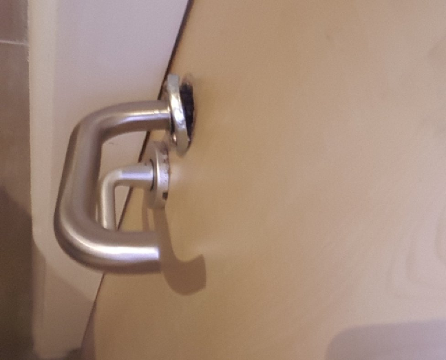 Image of broken door lock to toilet.