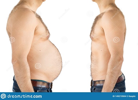 Image showing a guy having lost a lot of weight and losing his belly.