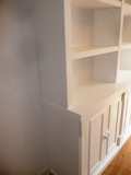 A whole wall of book/storage shelves